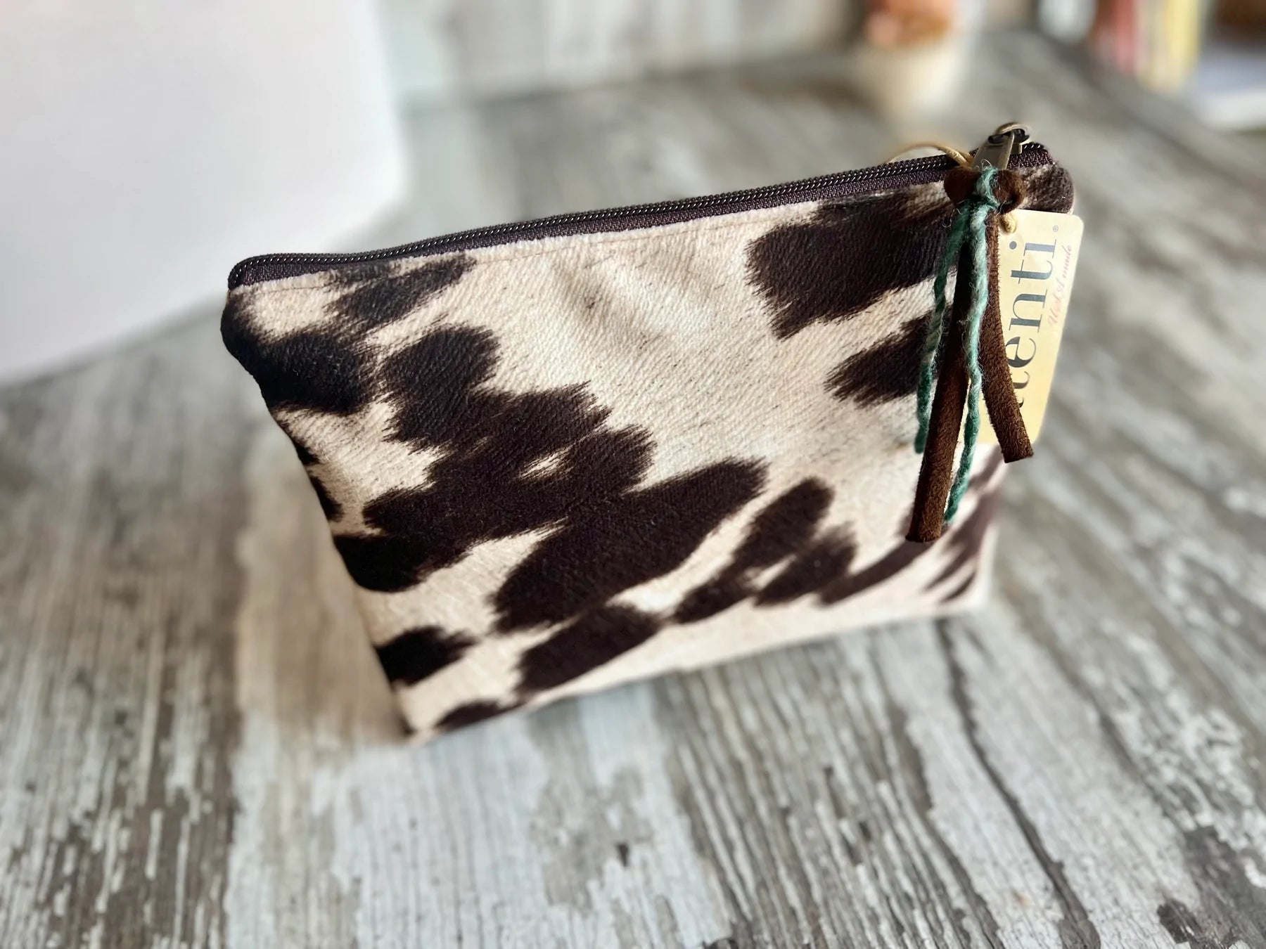 Close up of Atenti pouch in cowhide fabric
