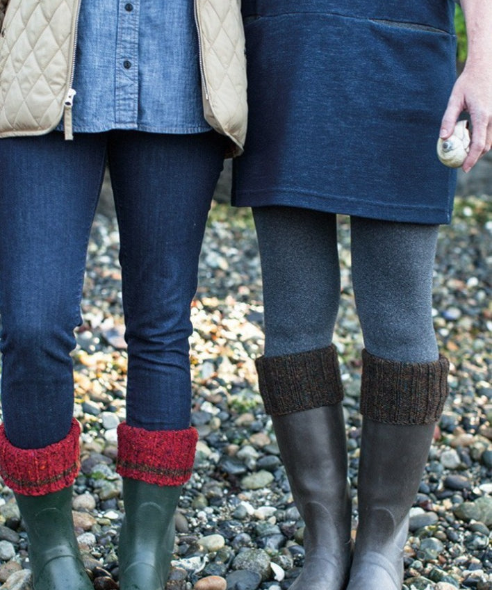 Two people wearing boots with boot cuff