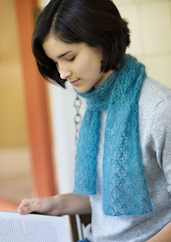 A woman wearing a knitted scarf