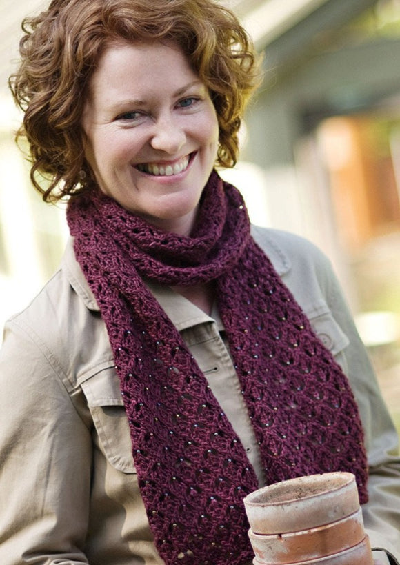 A woman wearing a knitted scarf