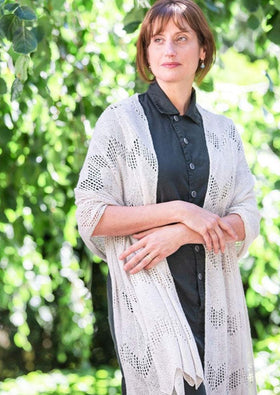 A woman wearing a knitted wrap