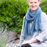 A woman wearing a knitted scarf