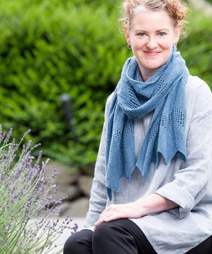 A woman wearing a knitted scarf