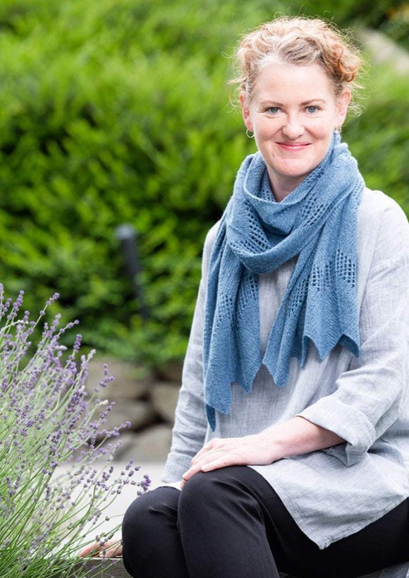 A woman wearing a knitted scarf
