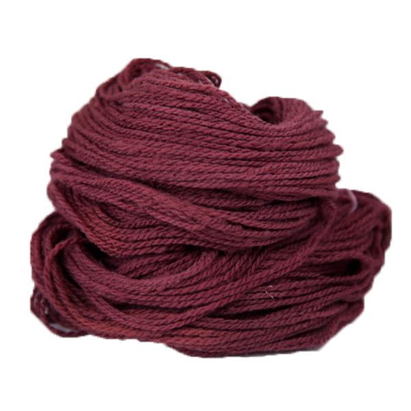 A maroon hank of the Mountain Meadow Wool Alpine collection.