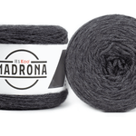 A photo of two dark gray cakes of HiKoo Madrona yarn