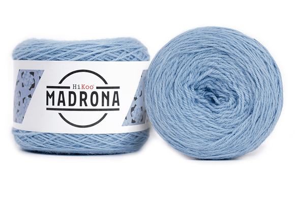 A photo of two light blue cakes of HiKoo Madrona yarn