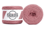 A photo of two pink cakes of HiKoo Madrona yarn