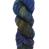 A colorful skein of blue and brown Malabrigo Rios yarn
