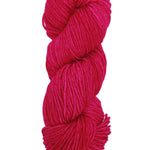 A colorful skein of fuscia Malabrigo Rios yarn