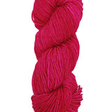 A colorful skein of fuscia Malabrigo Rios yarn