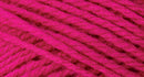 A close-up photo of a pink sample of Nature Spun yarn