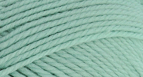 A close-up photo of a light green sample of Nature Spun yarn