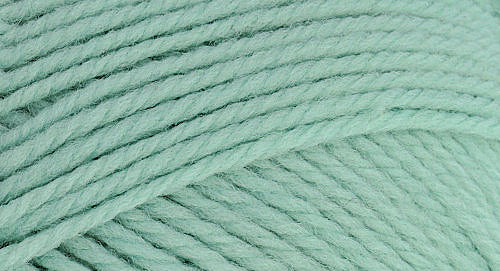 A close-up photo of a light green sample of Nature Spun yarn