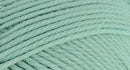 A close-up photo of a light green sample of Nature Spun yarn