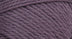 A close-up photo of a purple sample of Nature Spun yarn