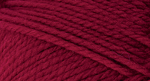 A close-up photo of a red sample of Nature Spun yarn
