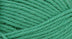 A close-up photo of a light green sample of Nature Spun yarn
