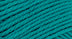 A close-up photo of a teal sample of Nature Spun yarn