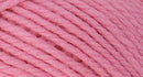 A close-up photo of a pink sample of Nature Spun yarn