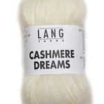 A photo of a natural cream skein of Lang Cashmere Dreams lace yarn
