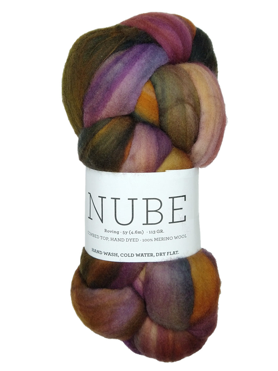 A photo of the purple, green, and yellow Piedras  Nube fiber braid