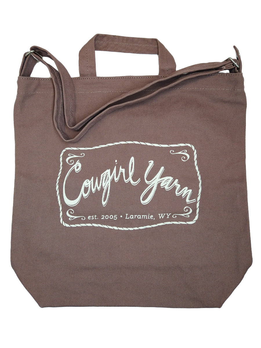 A peppercorn duck canvas bag with the Cowgirl Yarn logo