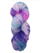 Hank  of the colorway Kiowa- variegated purple with speckles of bright blue and streaks of pink.