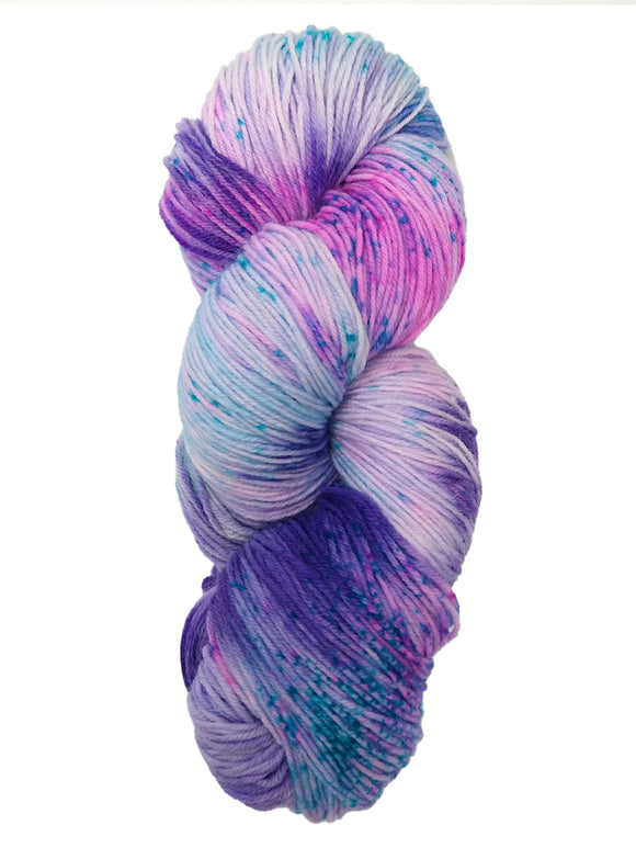 Hank  of the colorway Kiowa- variegated purple with speckles of bright blue and streaks of pink.