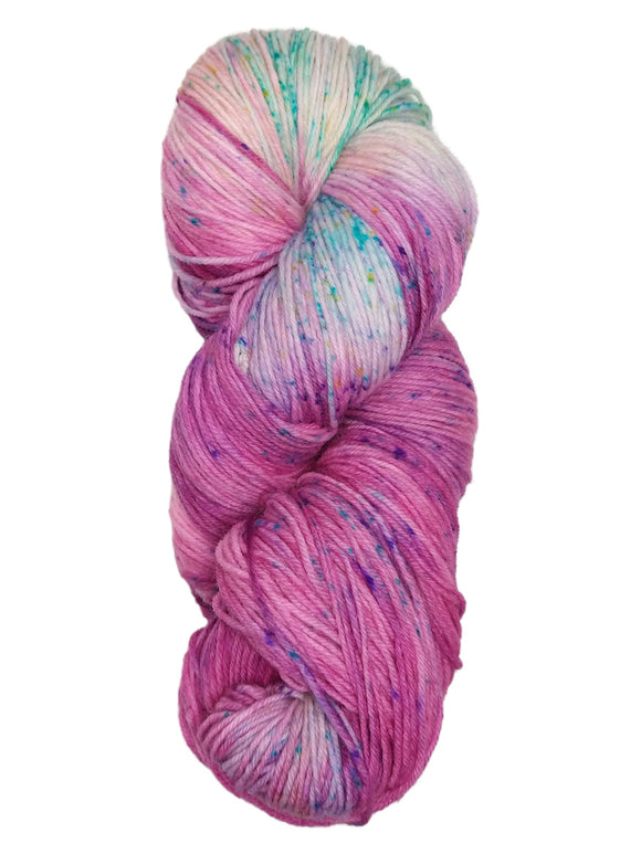 Hank of the colorway LaRamie- variegated hot pink with speckles of purple and streaks of bright blue.