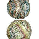 A colorful photo of two balls of James C. Brett Marble Chunky yarn