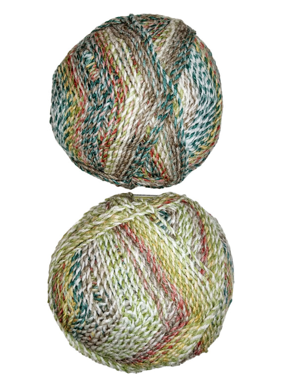 A colorful photo of two balls of James C. Brett Marble Chunky yarn