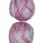 A colorful photo of two balls of James C. Brett Marble Chunky yarn