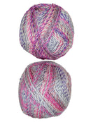 A colorful photo of two balls of James C. Brett Marble Chunky yarn