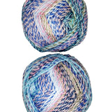 A photo of two colorful balls of Marble Chunky yarn.