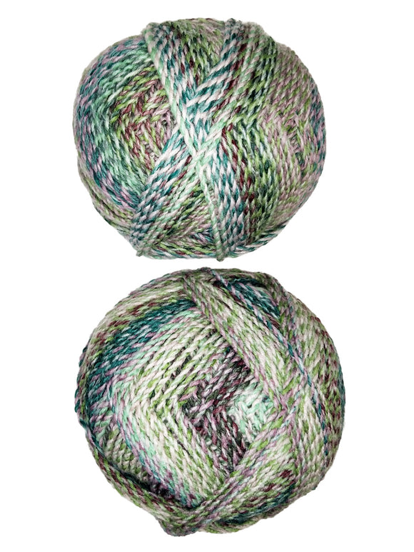 A photo of two colorful balls of Marble Chunky yarn.