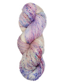 Hank of the colorway Washington- variegated pastel pink and cream with speckles of dark pink, blue, and purple.