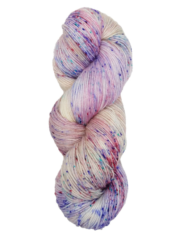 Hank of the colorway Washington- variegated pastel pink and cream with speckles of dark pink, blue, and purple.