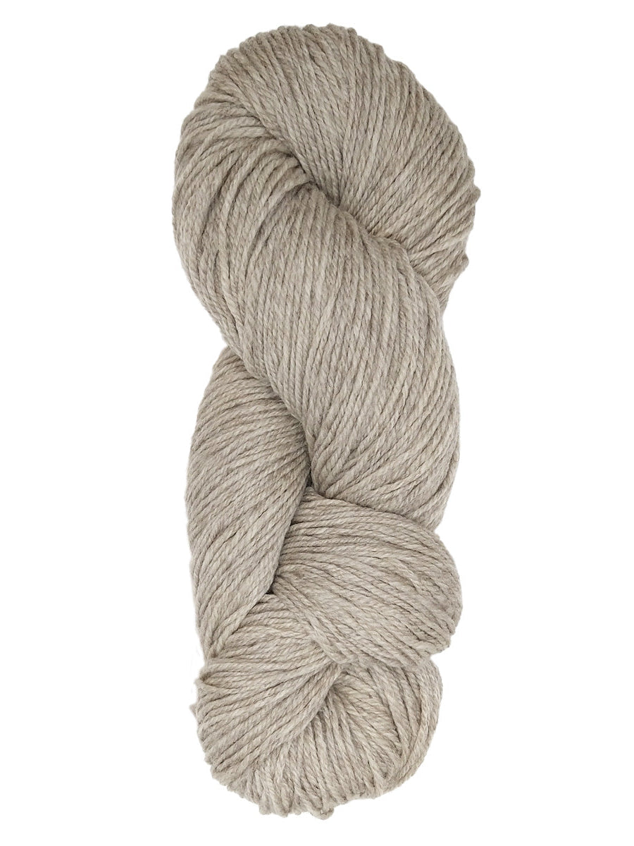A natural oatmeal colored hank of Prairie Spun yarn