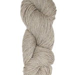 A natural oatmeal colored hank of Prairie Spun yarn