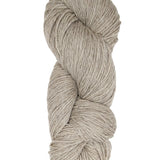 A natural oatmeal colored hank of Prairie Spun yarn