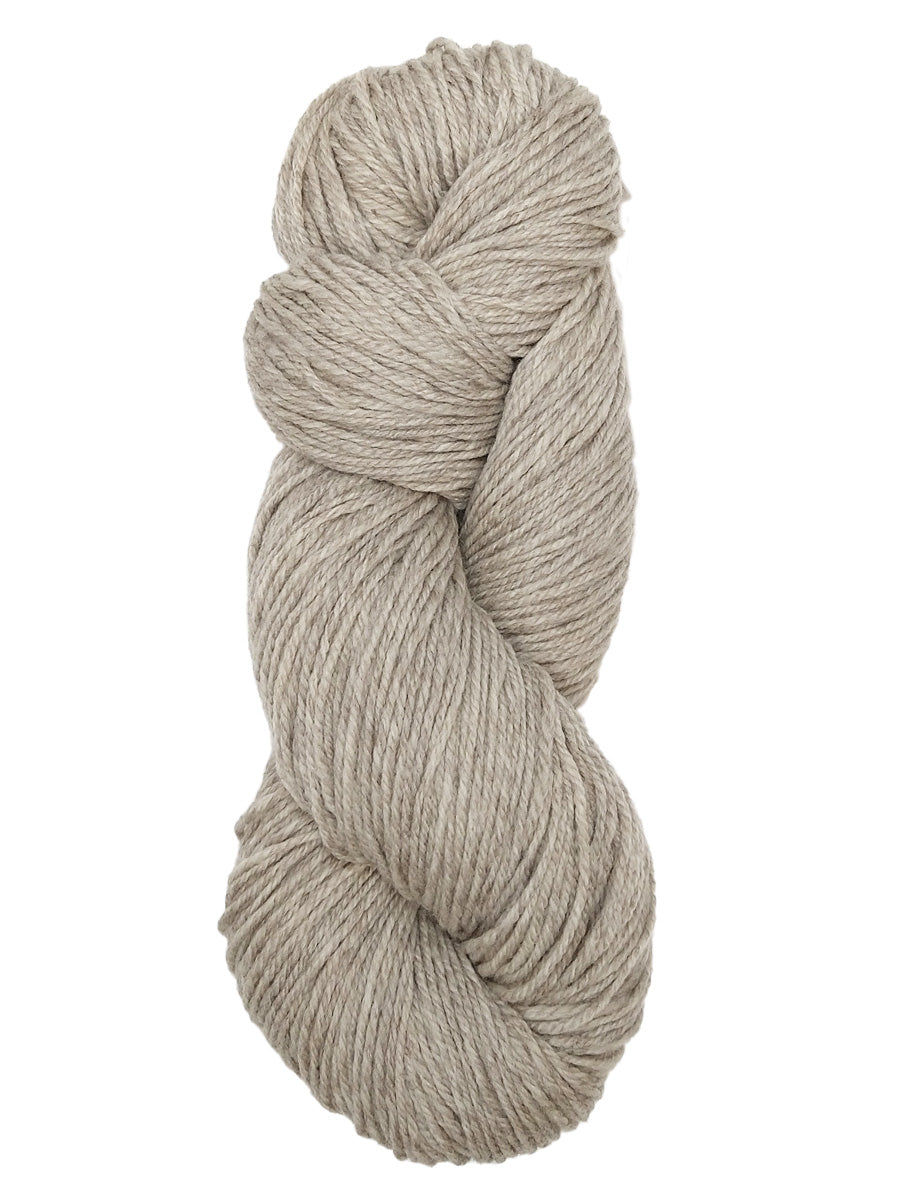 A natural oatmeal colored hank of Prairie Spun yarn