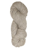 A natural oatmeal colored hank of Prairie Spun yarn