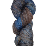 A colorful skein of blue and brown Malabrigo Rios yarn