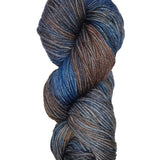A colorful skein of blue and brown Malabrigo Rios yarn
