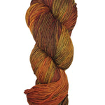 A colorful skein of oranges, yellows, and browns Malabrigo Rios yarn