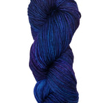 A colorful skein of blue and purple Malabrigo Rios yarn