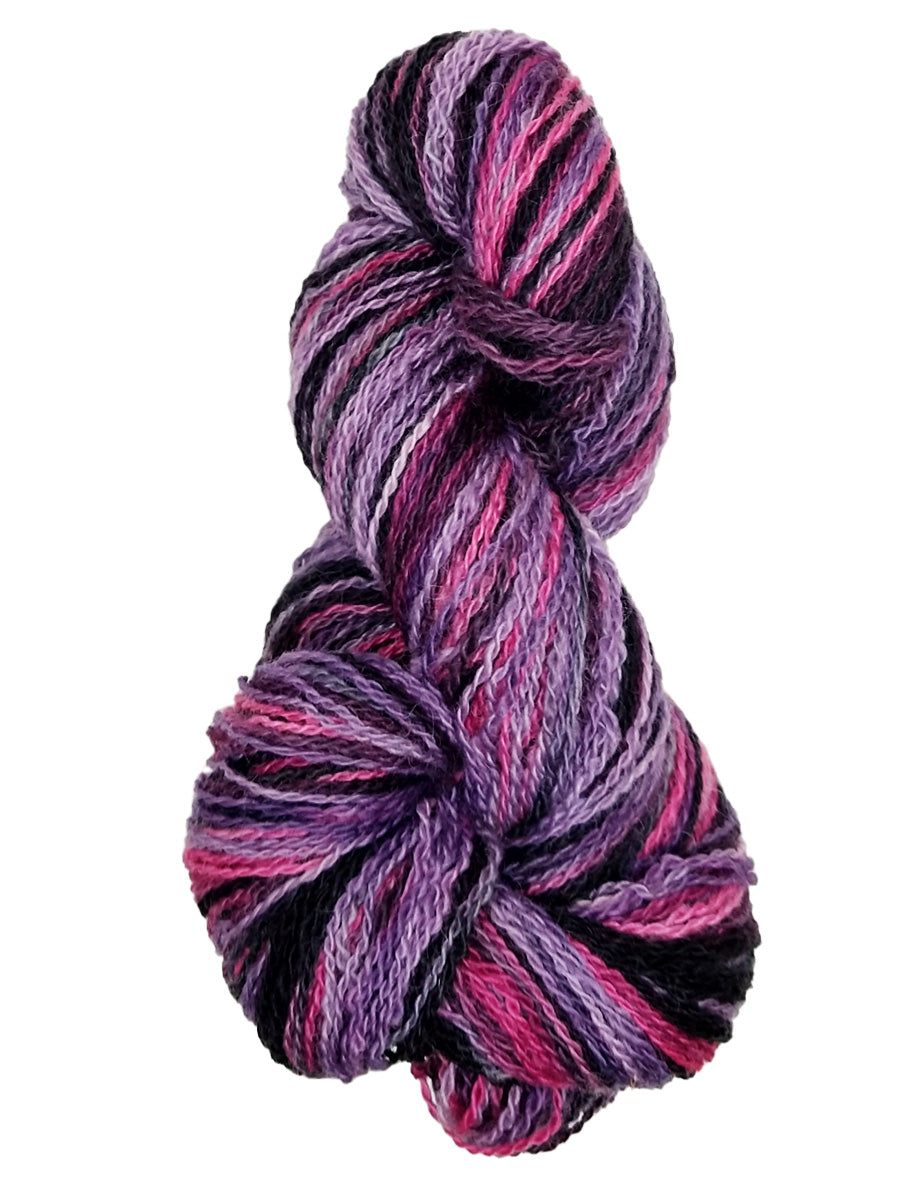 Photo of a hank of purple, pink and black yarn