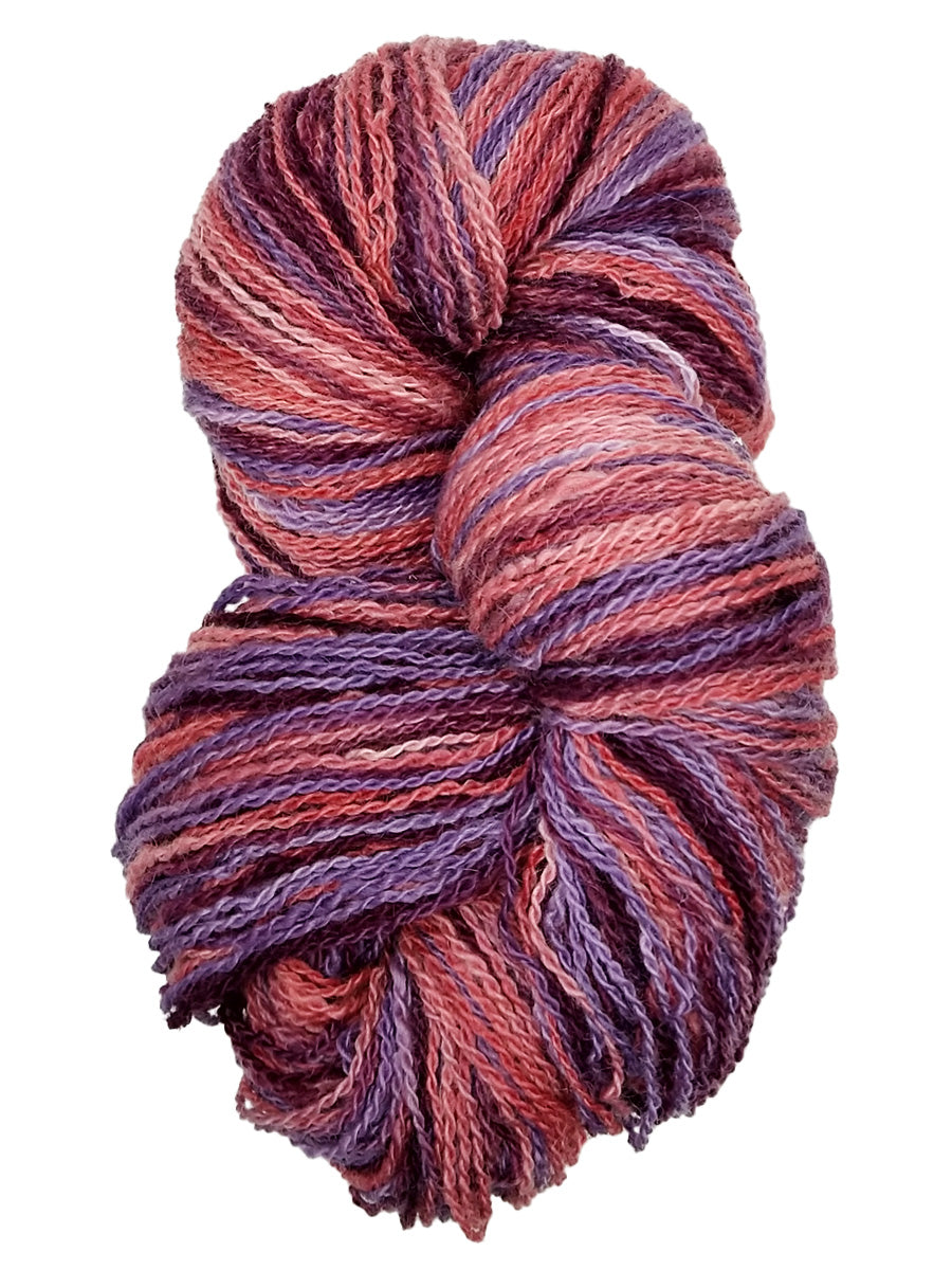 Photo of a hank of purple, pink and maroon yarn