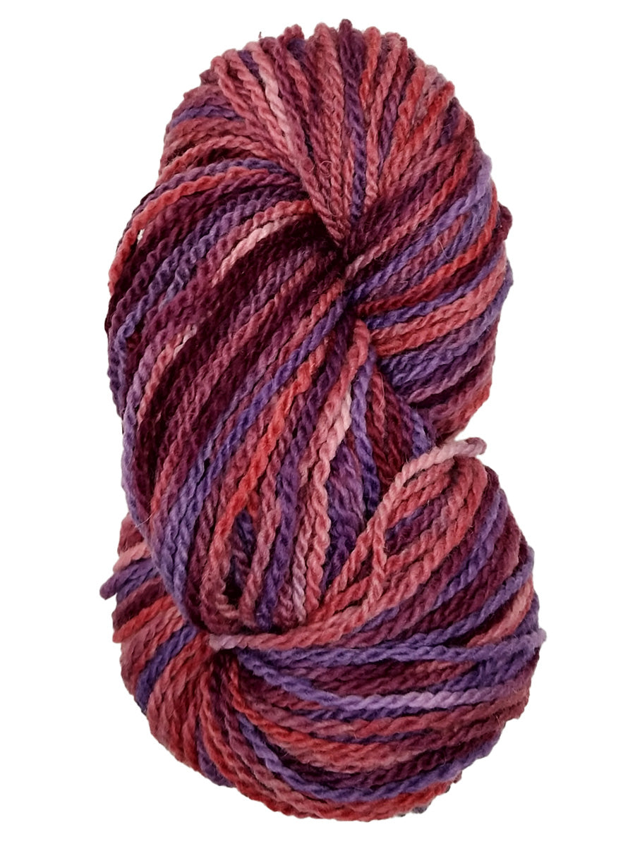 A photo of a hank of purple, pink and maroon yarn